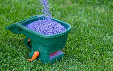 fertilizer spreader on grass